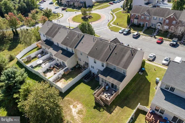 an aerial view of a house with a swimming pool