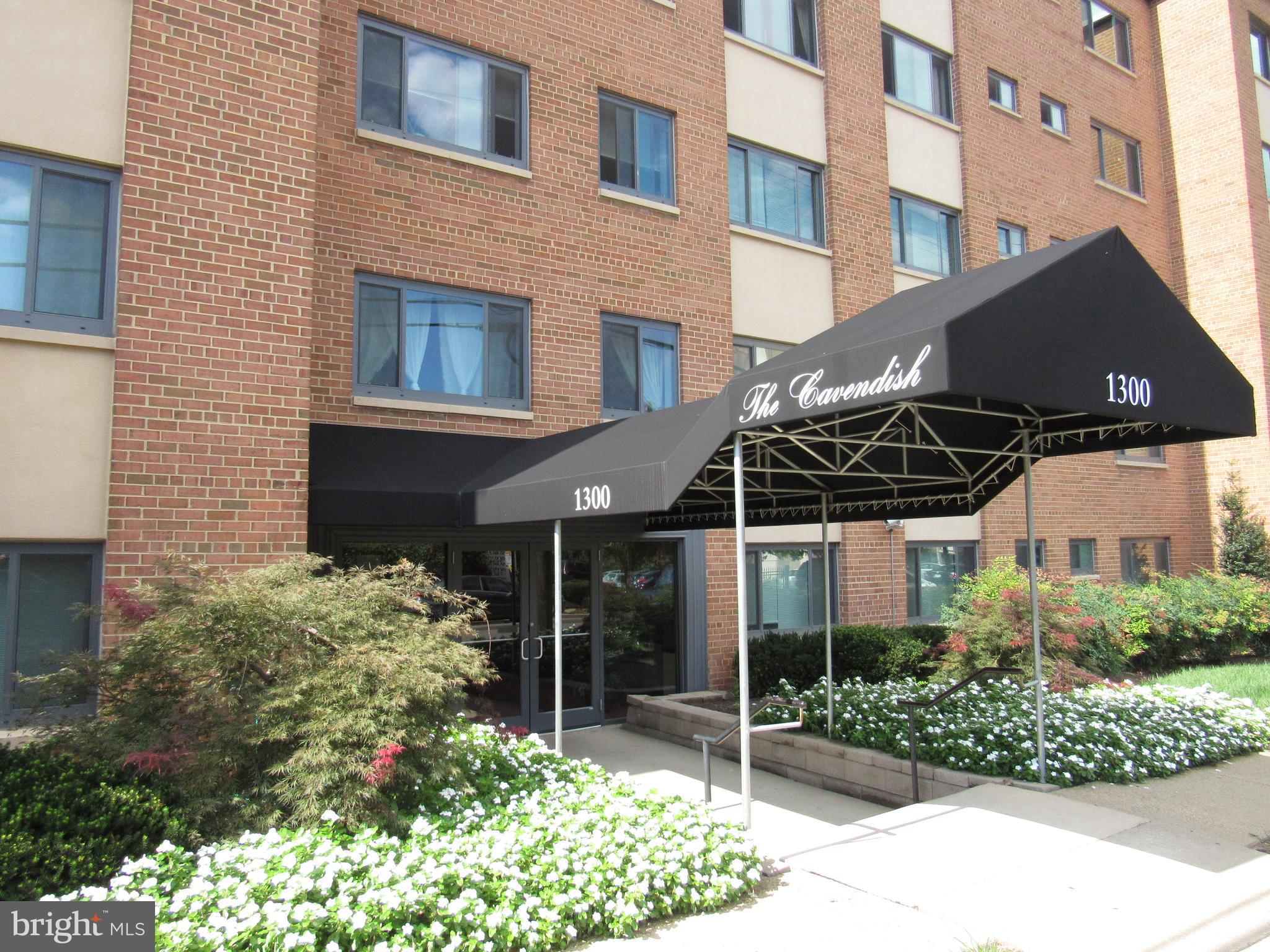 1300 South Arlington Ridge Road, Unit 617 Arlington, VA 22202 - Photo 1 of 25 a front view of a house with a garden