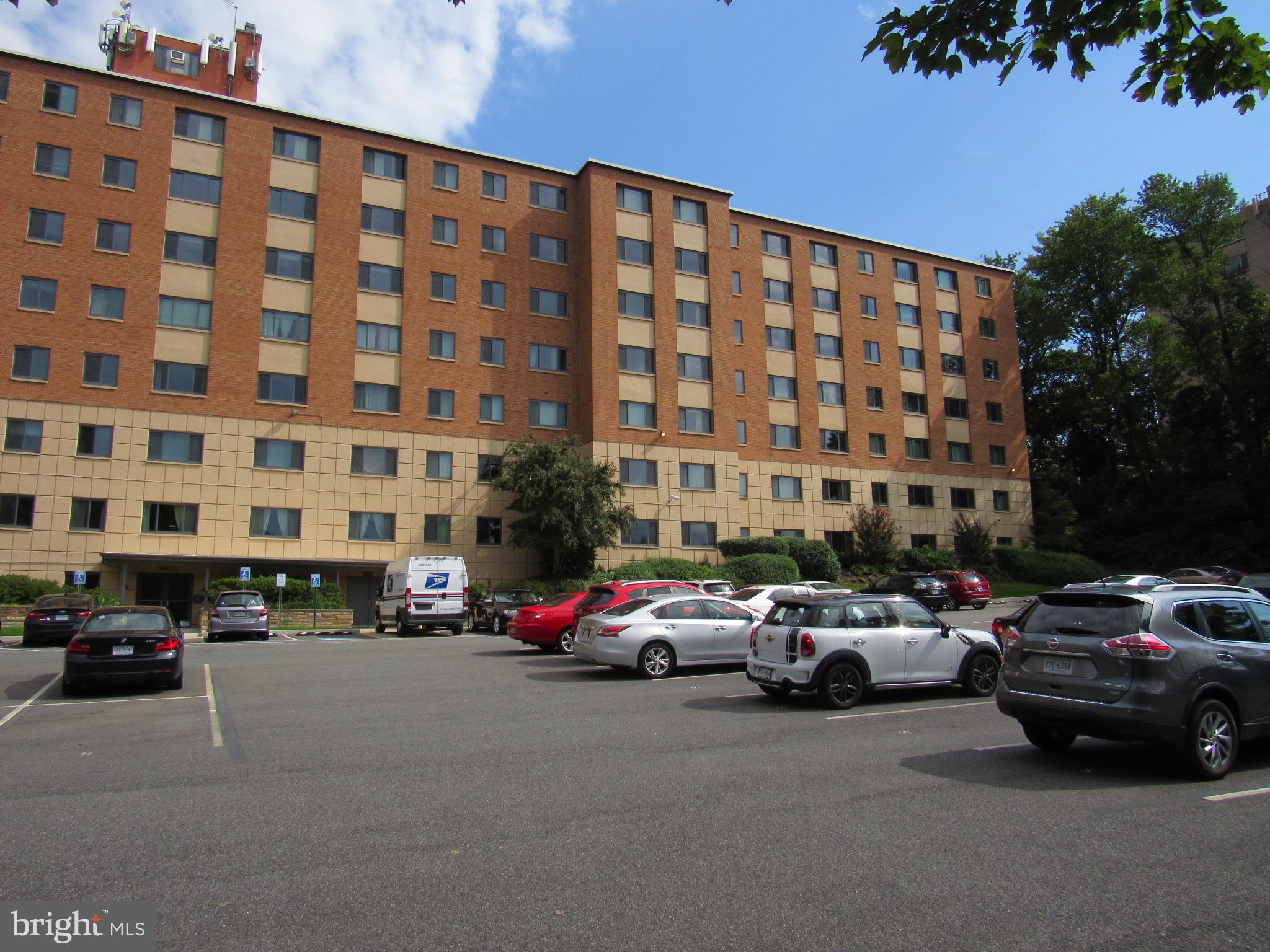 1300 South Arlington Ridge Road, Unit 617 Arlington, VA 22202 - Photo 17 of 25 a buildings with car parked in front of it