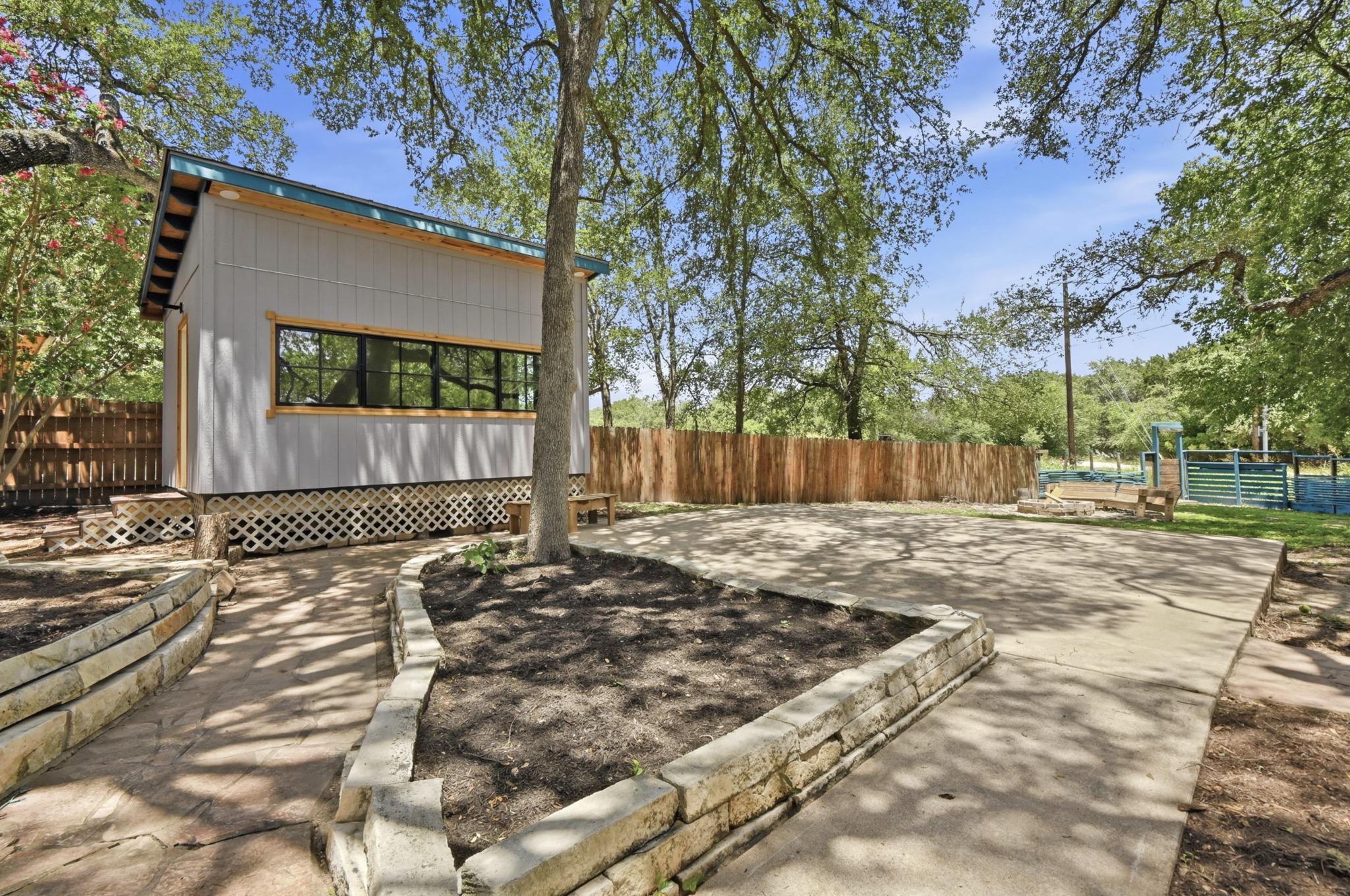 708 Shade Tree Drive Austin, TX 78748 - Photo 26 of 32 Your private fenced-in backyard provides multiple spaces for gathering and customizing your ideal outdoor experience.