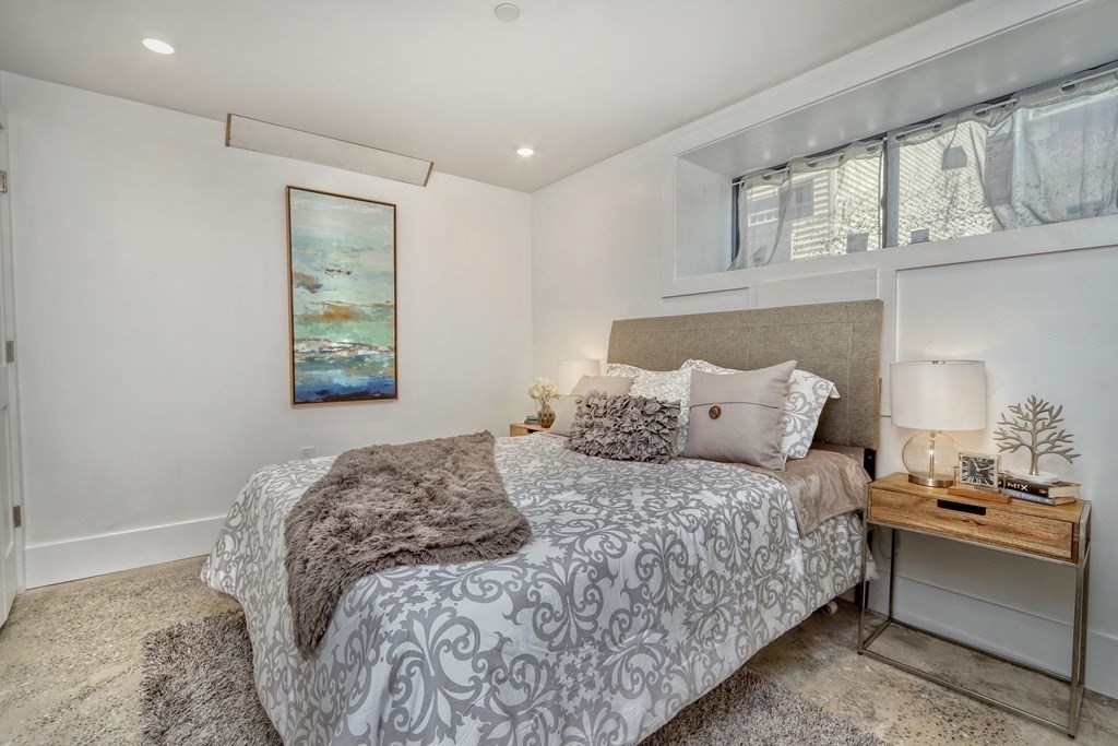 4 Everett Place, Unit 1 Boston, MA 02128 - Photo 11 of 19 a bedroom with a bed and a window