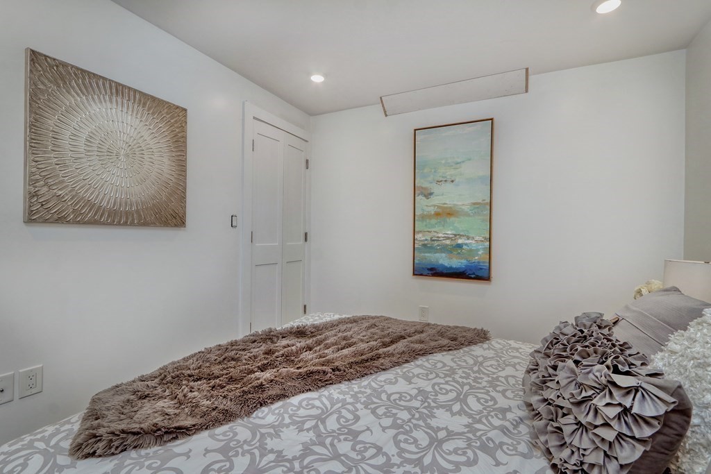 4 Everett Place, Unit 1 Boston, MA 02128 - Photo 12 of 19 a bedroom with a bed and a window