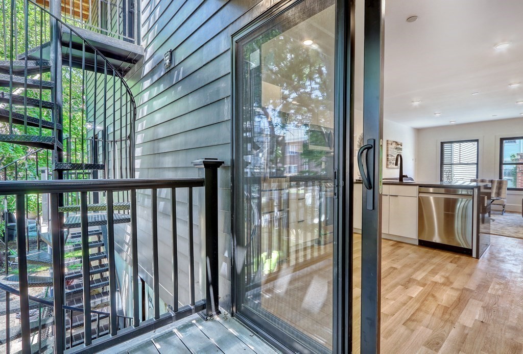 4 Everett Place, Unit 1 Boston, MA 02128 - Photo 18 of 19 a view of a living room hardwood and balcony