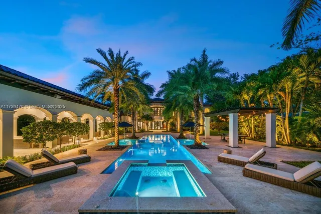 a swimming pool with outdoor seating