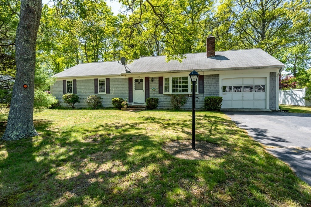 231 Monomoy Circle Barnstable, MA 02632 - Photo 1 of 28 a backyard of a house with yard barbeque oven and outdoor seating