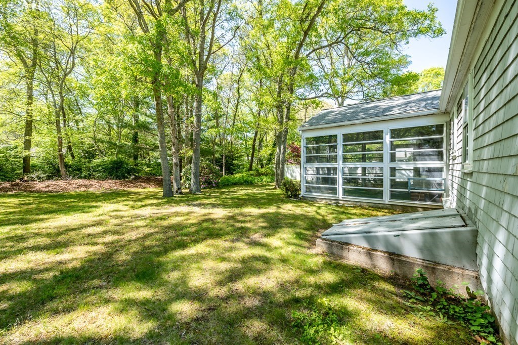 231 Monomoy Circle Barnstable, MA 02632 - Photo 4 of 28 a view of a house with pool and sitting area