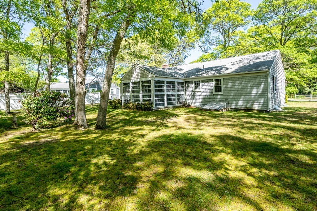 231 Monomoy Circle Barnstable, MA 02632 - Photo 5 of 28 a view of a house with a yard