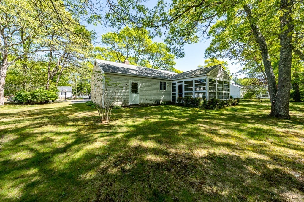 231 Monomoy Circle Barnstable, MA 02632 - Photo 6 of 28 a view of a house with a yard