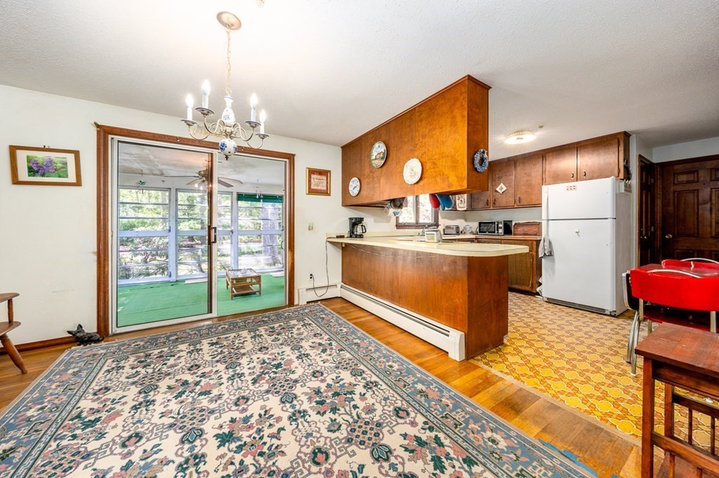 231 Monomoy Circle Barnstable, MA 02632 - Photo 10 of 28 a kitchen with stainless steel appliances granite countertop a sink stove and refrigerator
