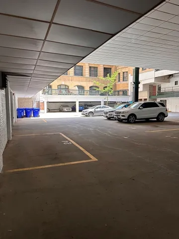 a view of room with wooden floor