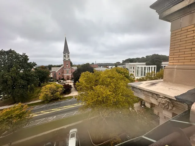 a view of balcony with wooden floor