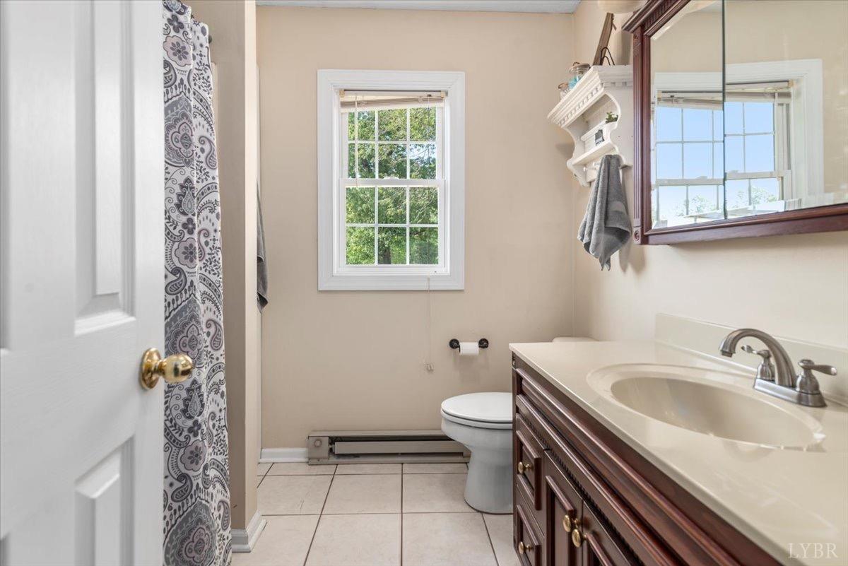 152 Pine Street Amherst, VA 24521 - Photo 21 of 53 a bathroom with a sink toilet and shower