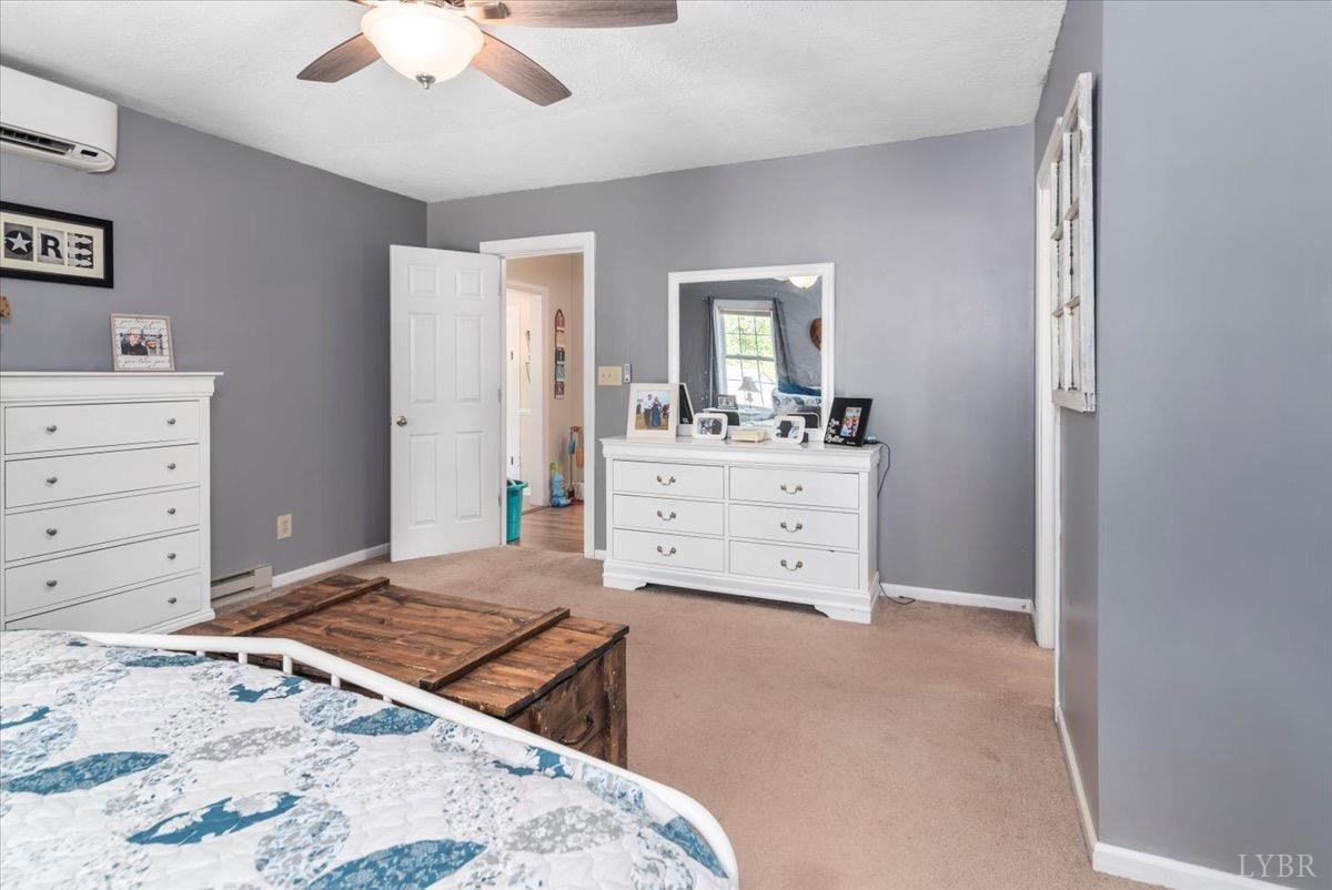 152 Pine Street Amherst, VA 24521 - Photo 23 of 53 a bedroom with a bed and a dresser