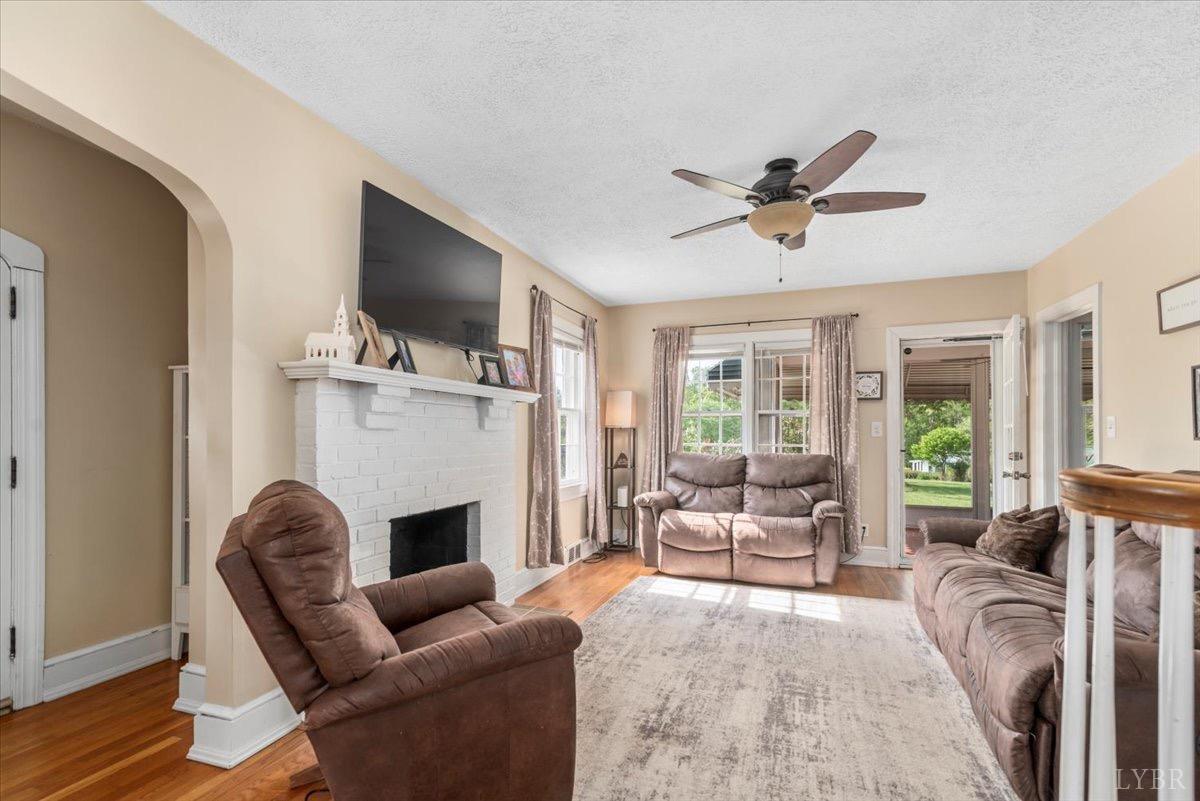 152 Pine Street Amherst, VA 24521 - Photo 7 of 53 a living room with furniture a flat screen tv and a fireplace