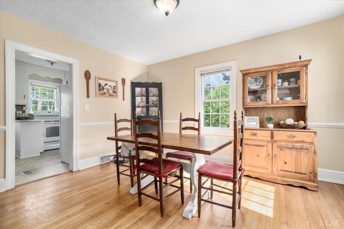 152 Pine Street Amherst, VA 24521 - Photo 9 of 53 a dining room with furniture and wooden floor