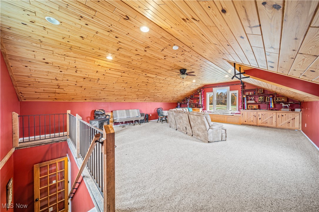 4804 Guest Road Jefferson, OH 44047 - Photo 24 of 48 Bonus room with wooden ceiling, ceiling fan, lofted ceiling, and carpet floors