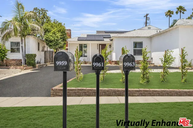 a front view of house with yard and outdoor seating