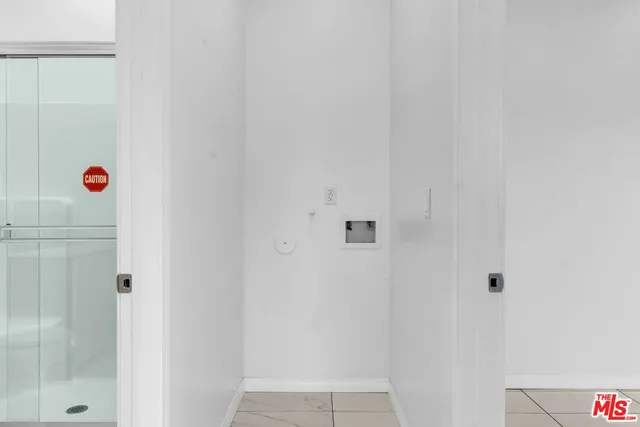 a view of an empty room with windows