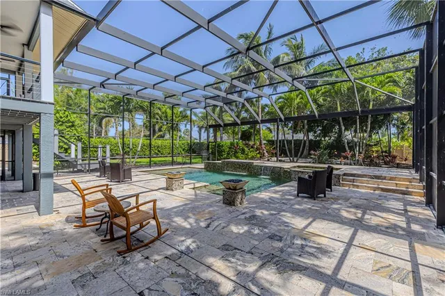 a view of a swimming pool with a patio
