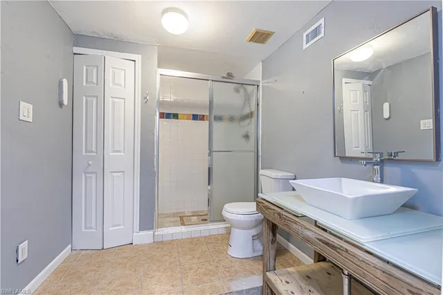 a view of a house with backyard porch and sitting area