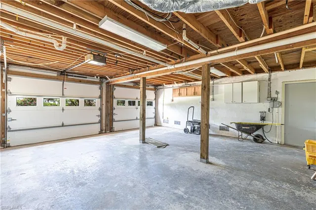 a view of a room with wooden floors