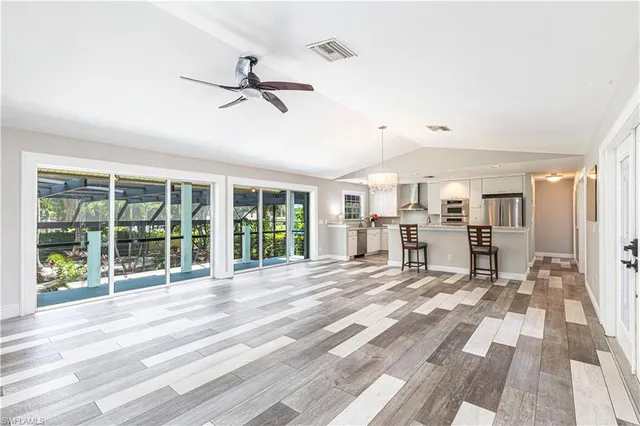 a view of a patio with a table chairs and wooden deck