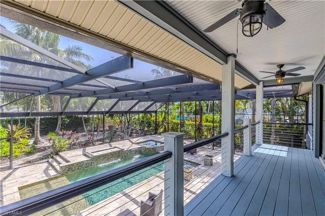 a kitchen with stainless steel appliances kitchen island granite countertop a refrigerator and a sink