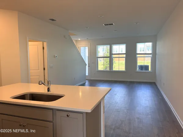 a kitchen with sink and window