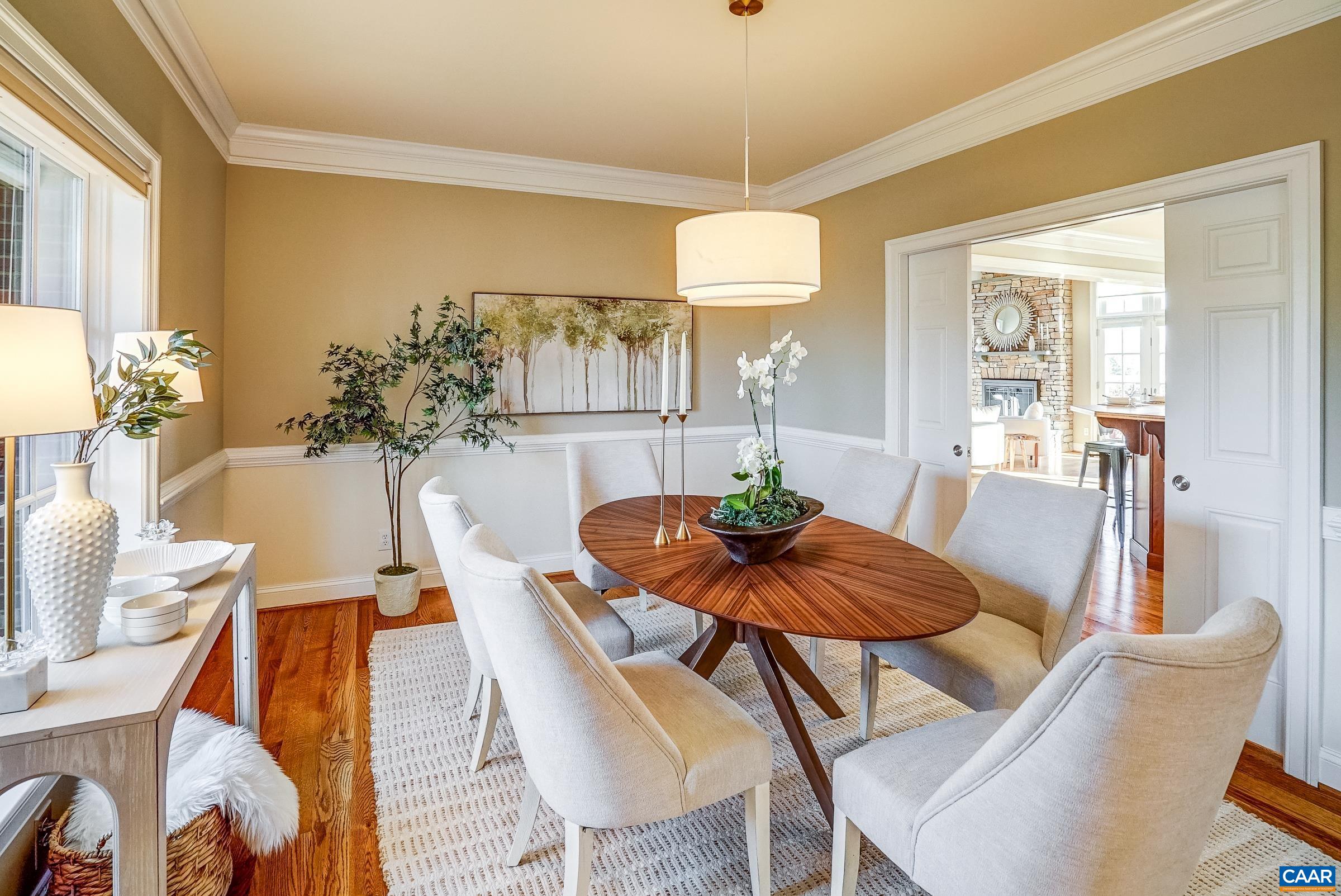801 Half Mile Branch Road Crozet, VA 22932 - Photo 16 of 69 a view of a dining room with furniture wooden floor and chandelier