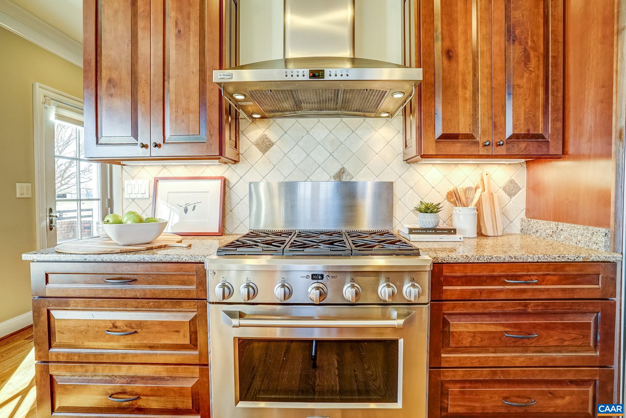 801 Half Mile Branch Road Crozet, VA 22932 - Photo 22 of 69 a stove top oven sitting inside of a kitchen