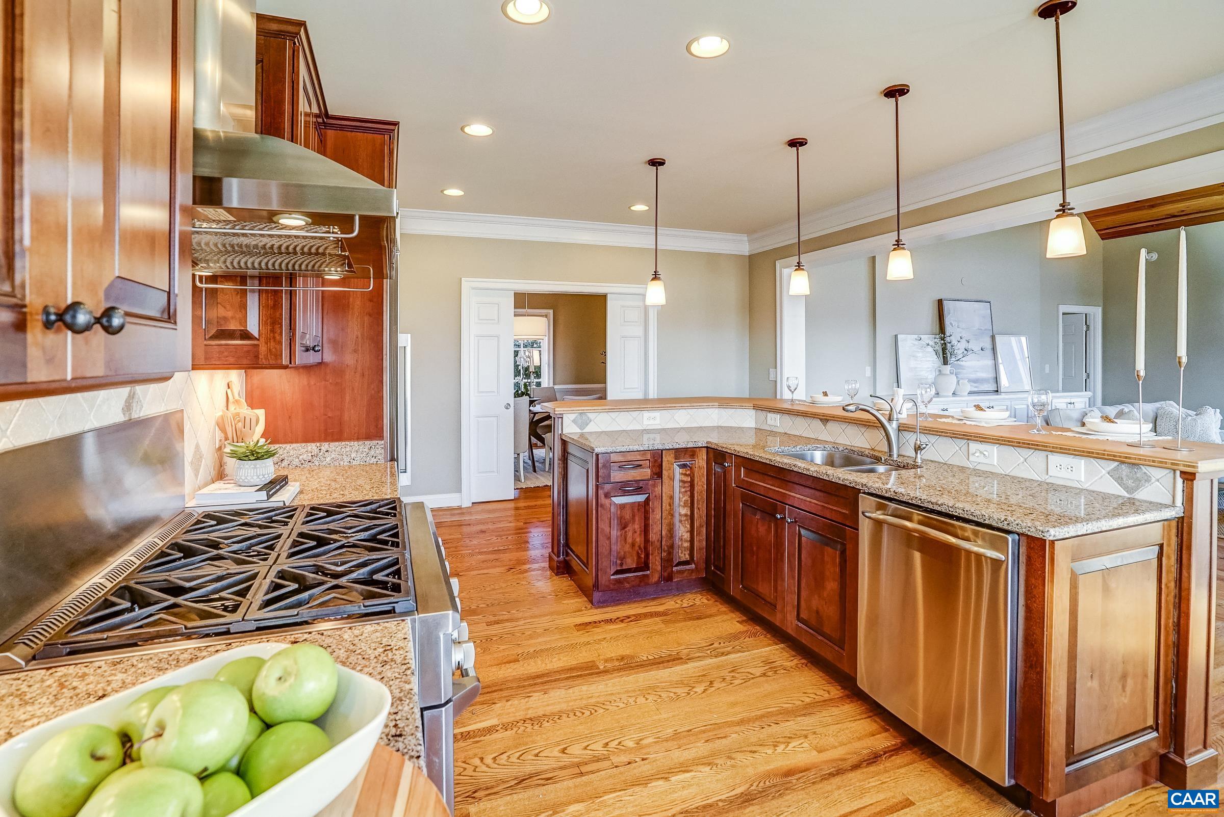 801 Half Mile Branch Road Crozet, VA 22932 - Photo 23 of 69 a large kitchen with kitchen island granite countertop a large center island and stainless steel appliances