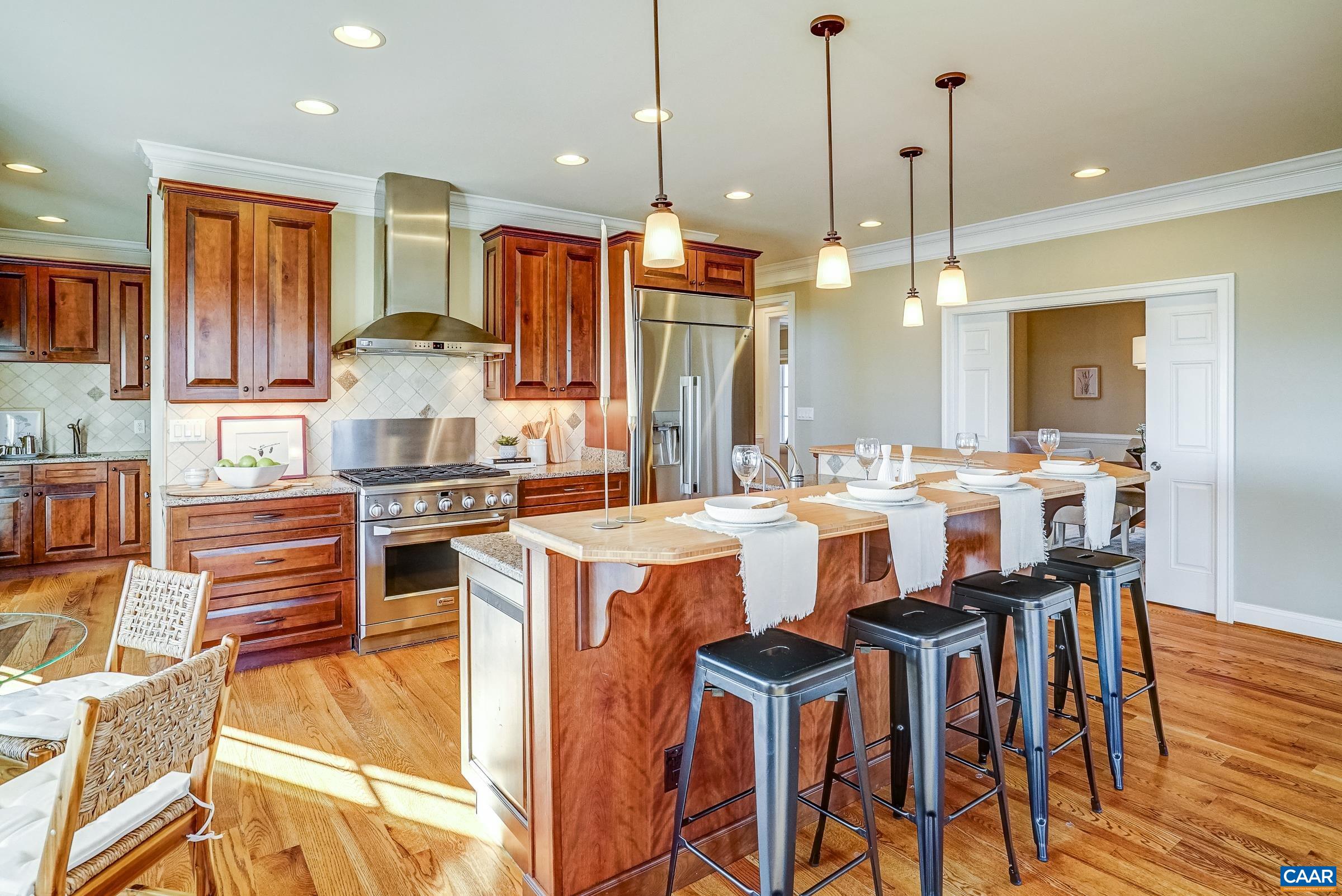 801 Half Mile Branch Road Crozet, VA 22932 - Photo 24 of 69 a large kitchen with a table and chairs