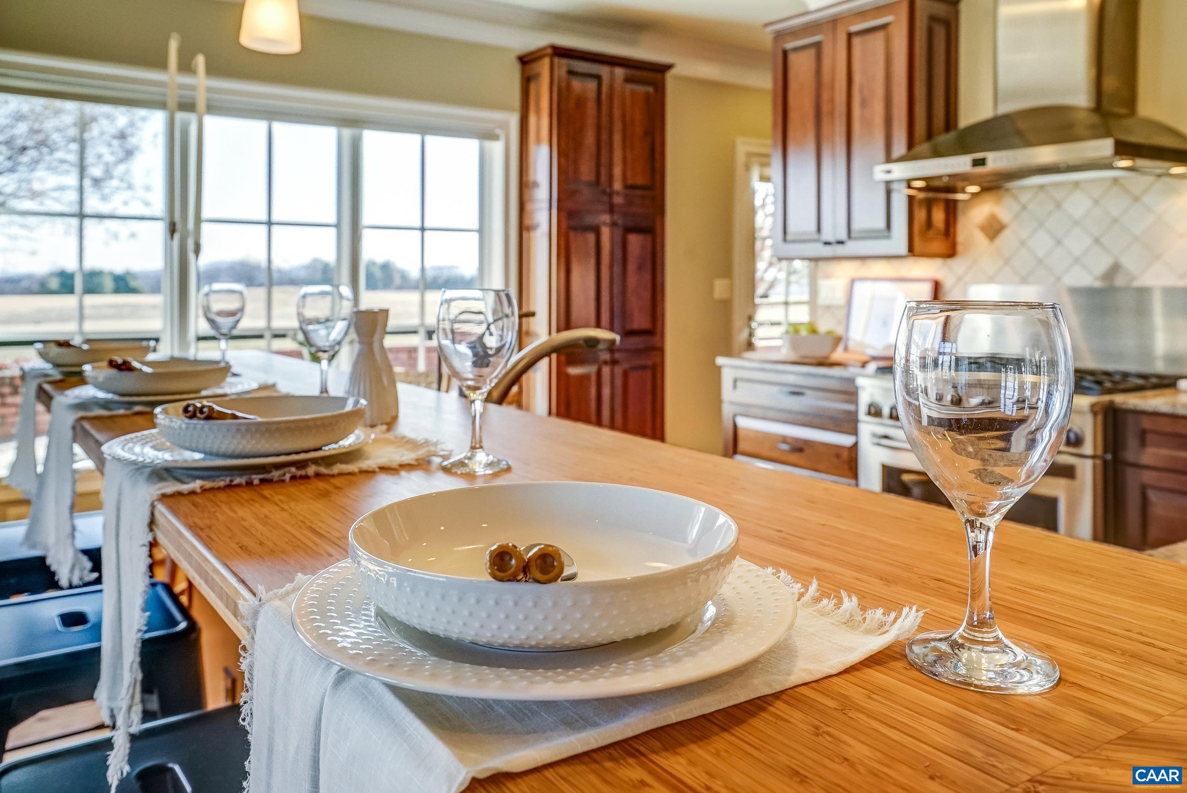 801 Half Mile Branch Road Crozet, VA 22932 - Photo 25 of 69 a dining table with chairs and wooden floor