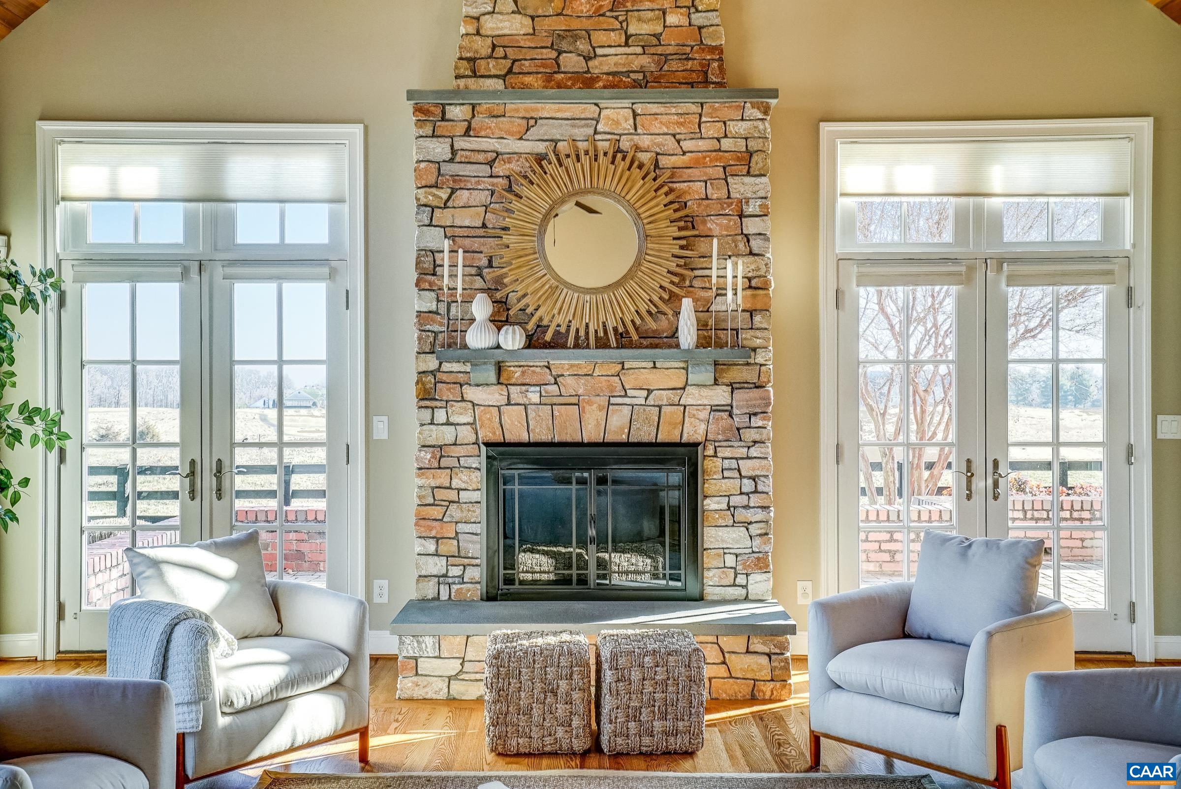 801 Half Mile Branch Road Crozet, VA 22932 - Photo 30 of 69 a living room with furniture a fireplace and a large window