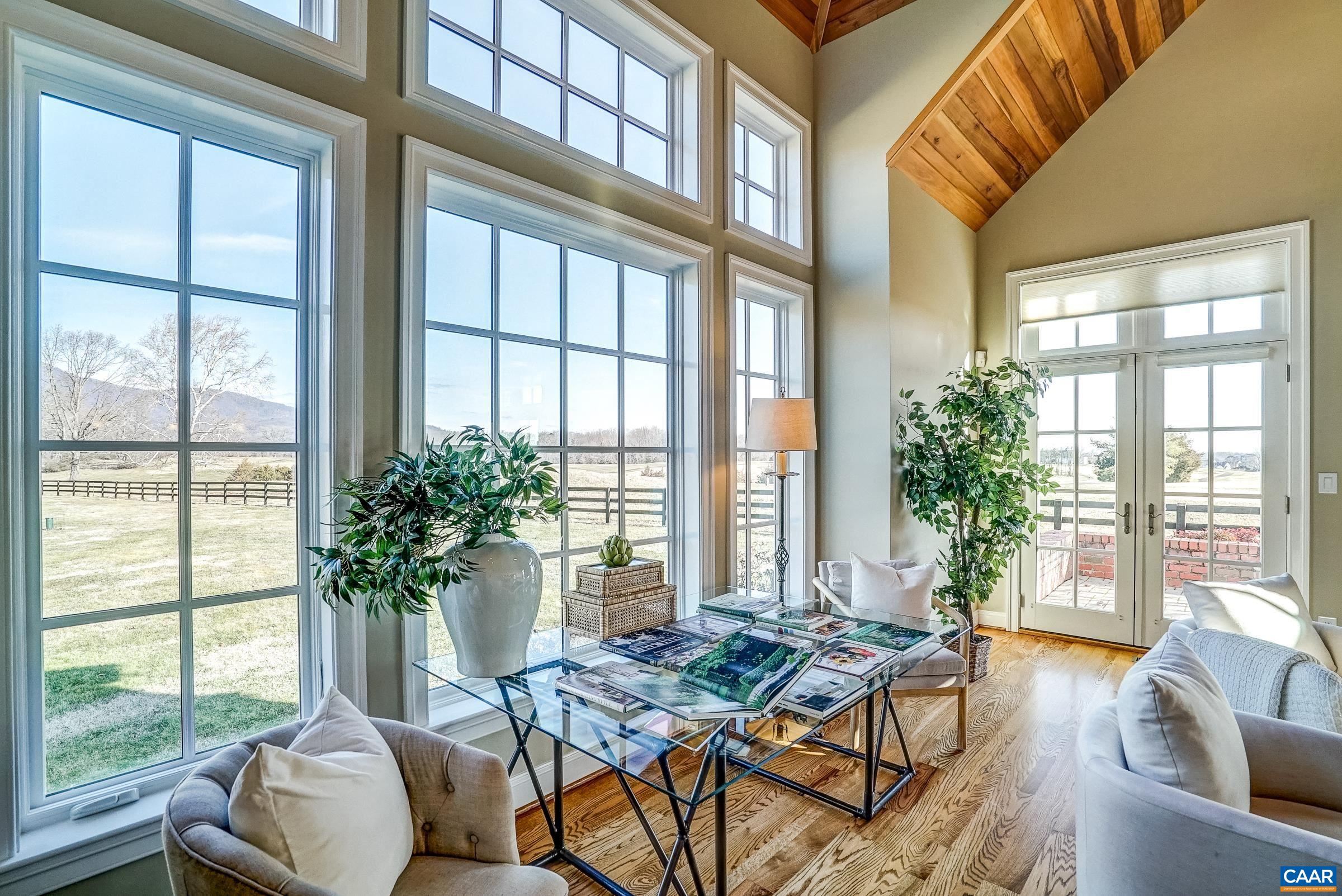 801 Half Mile Branch Road Crozet, VA 22932 - Photo 33 of 69 a living room with furniture and floor to ceiling windows