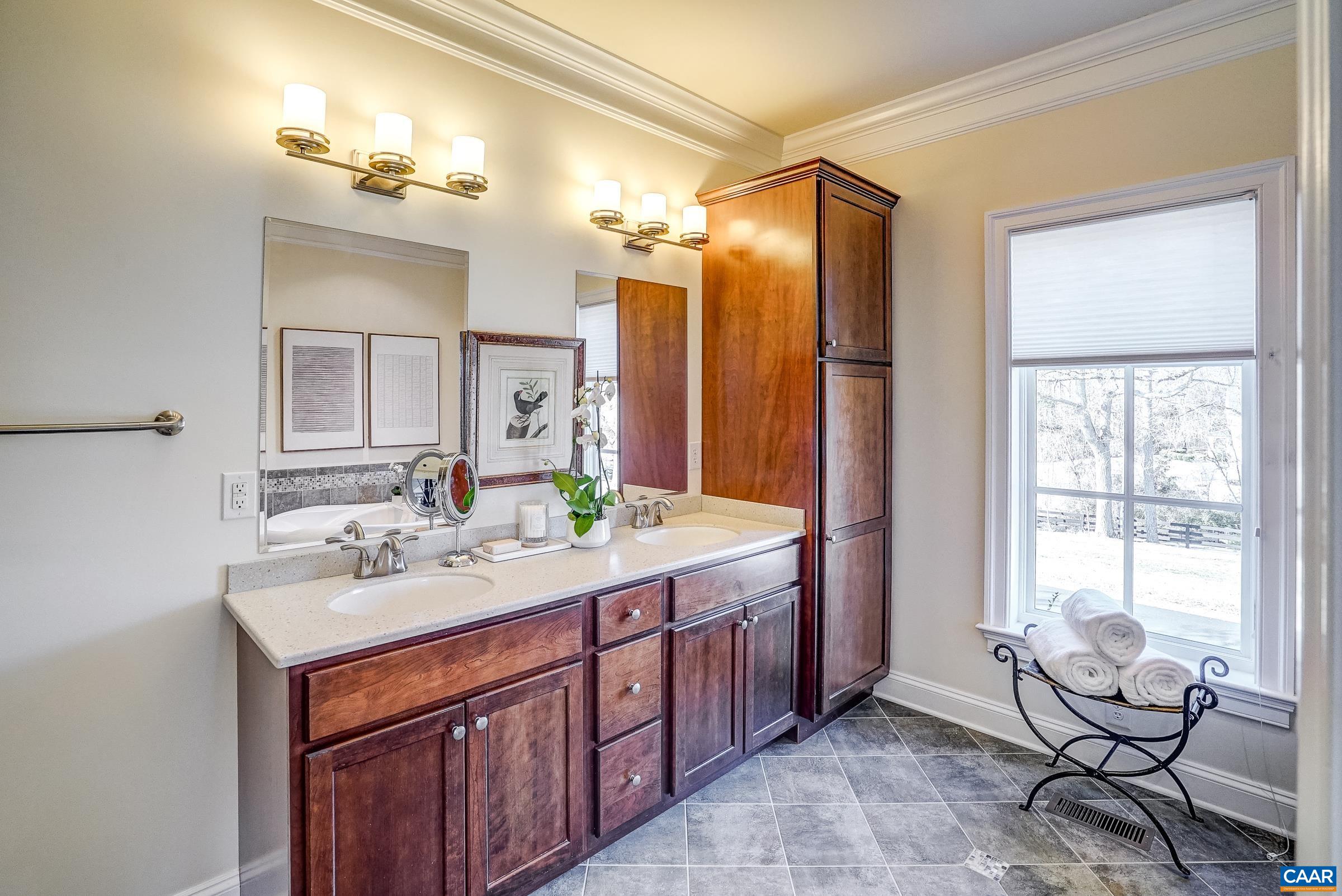 801 Half Mile Branch Road Crozet, VA 22932 - Photo 38 of 69 a spacious bathroom with a double vanity sink and a mirror