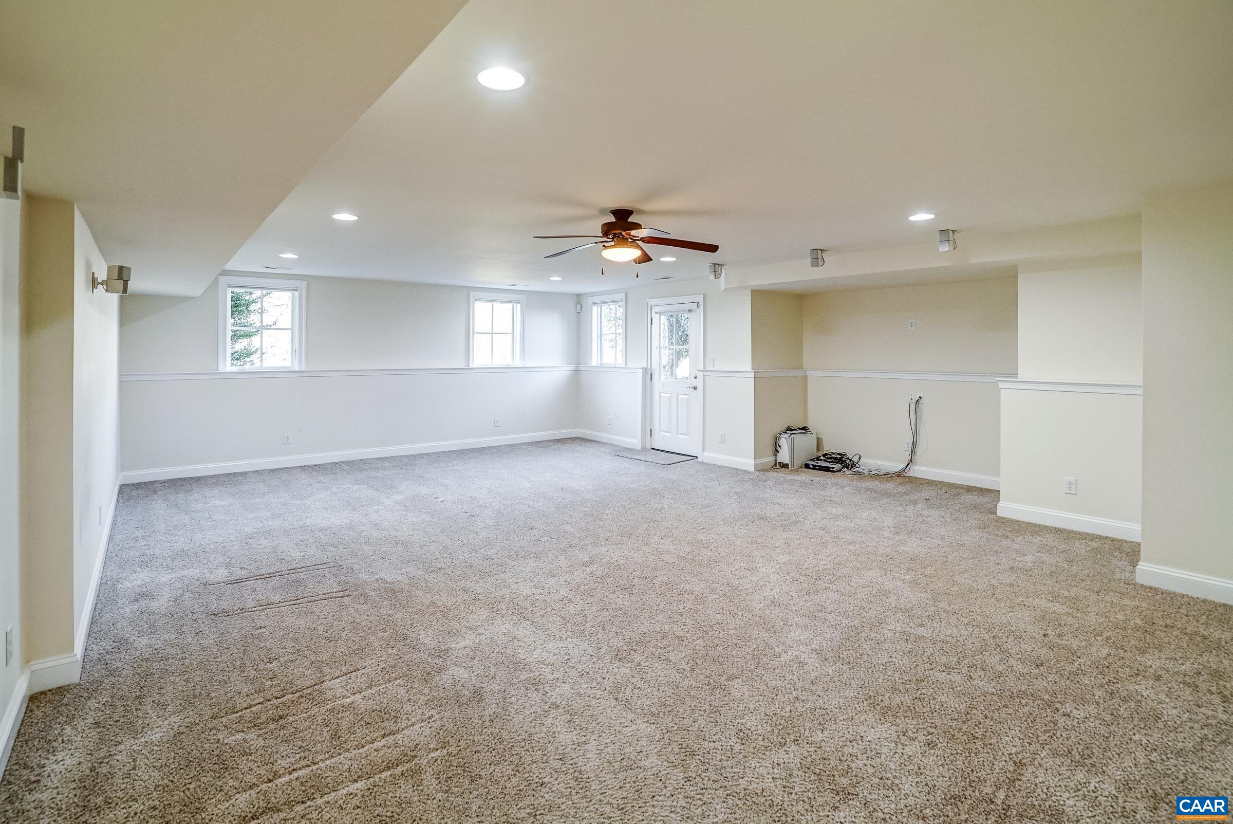 801 Half Mile Branch Road Crozet, VA 22932 - Photo 57 of 69 an empty room with a ceiling fan and window