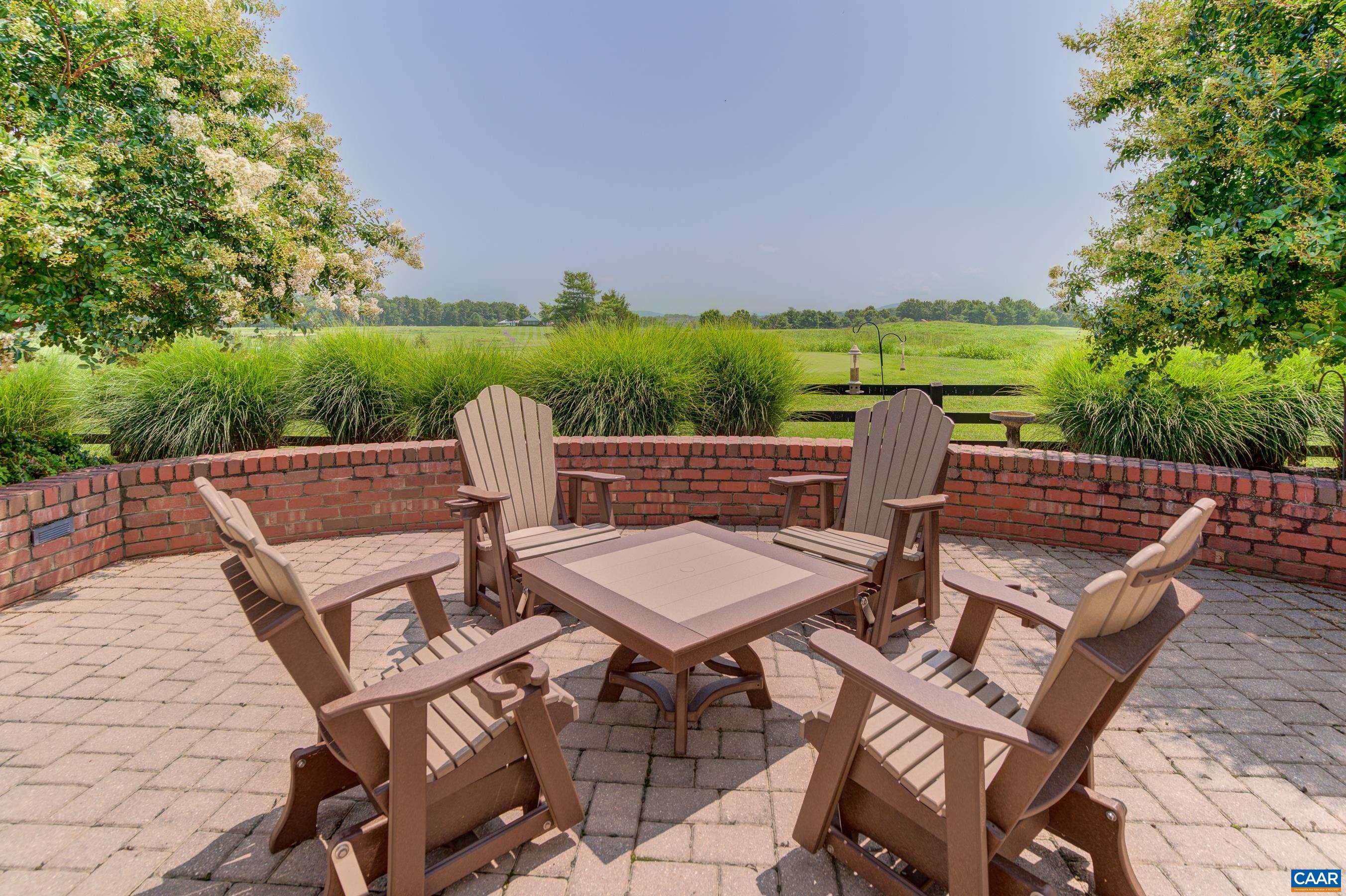 801 Half Mile Branch Road Crozet, VA 22932 - Photo 61 of 69 a view of a patio with two chairs and a table
