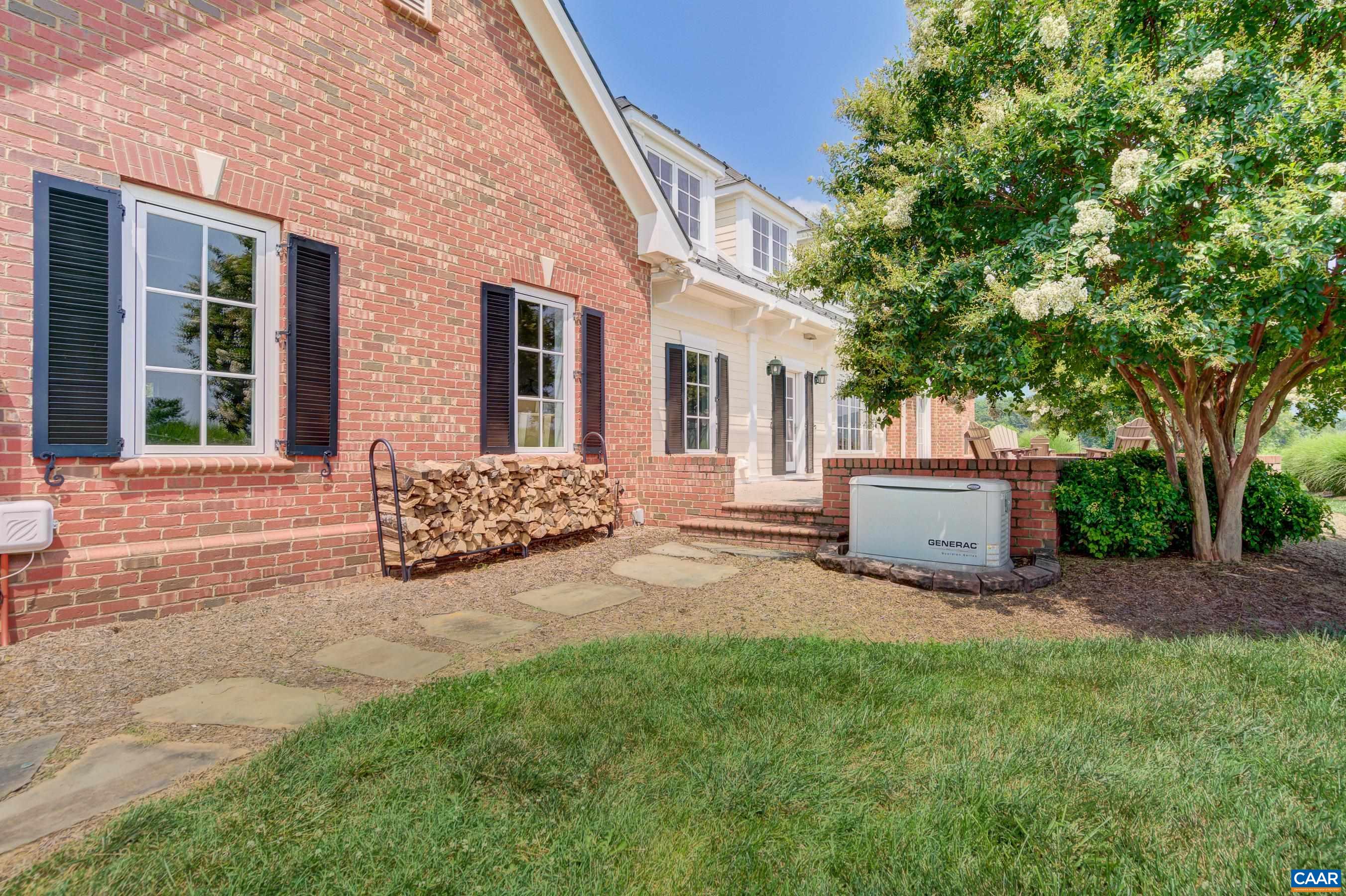 801 Half Mile Branch Road Crozet, VA 22932 - Photo 67 of 69 a view of a house with backyard sitting area and garden