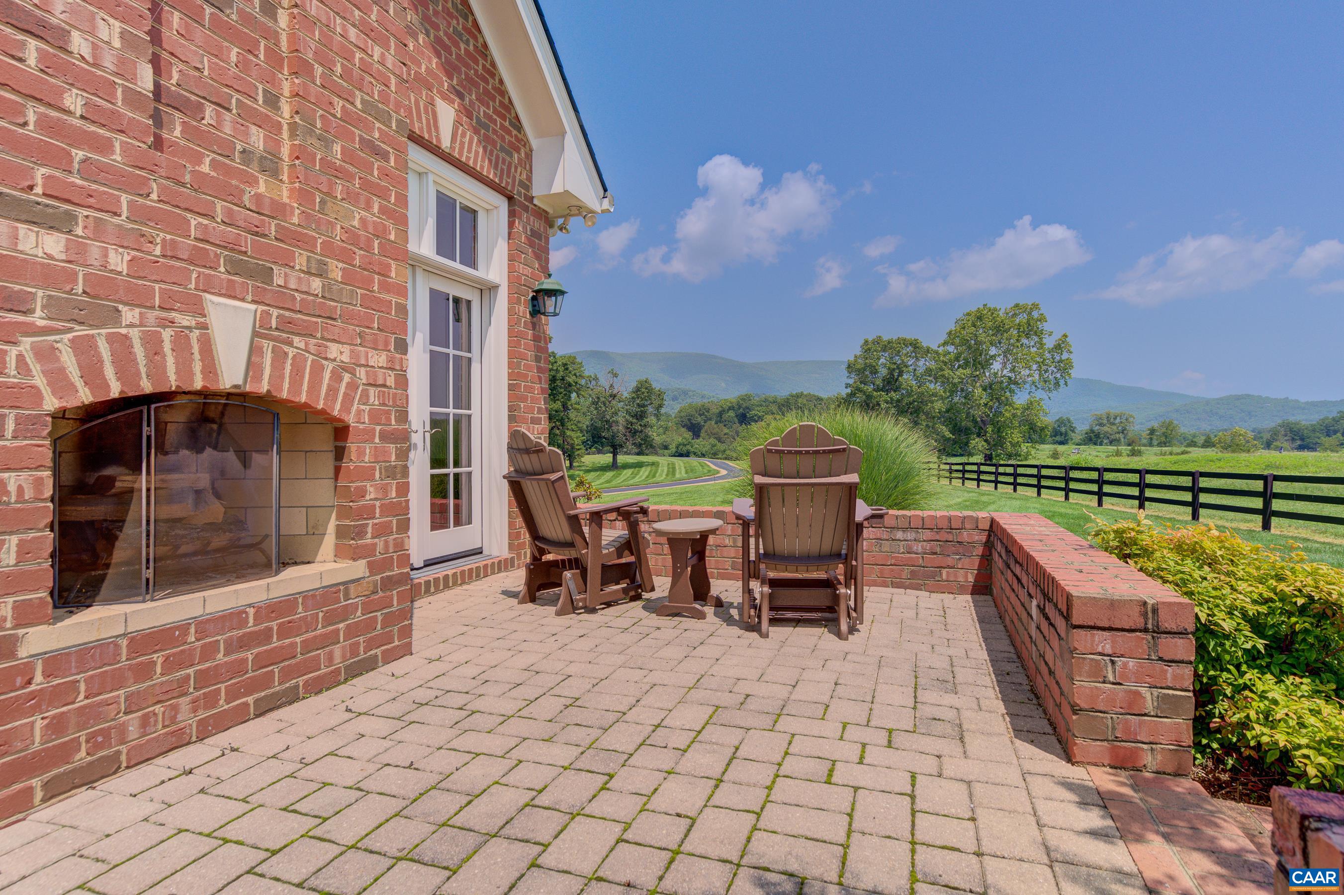 801 Half Mile Branch Road Crozet, VA 22932 - Photo 68 of 69 a view of a patio with a table and chairs