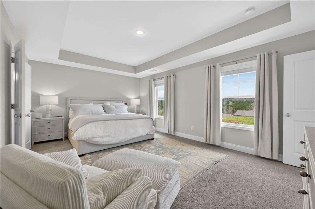 223 Timber Ridge Dawsonville, GA 30534 - Photo 12 of 24 a bedroom with a large bed and a window