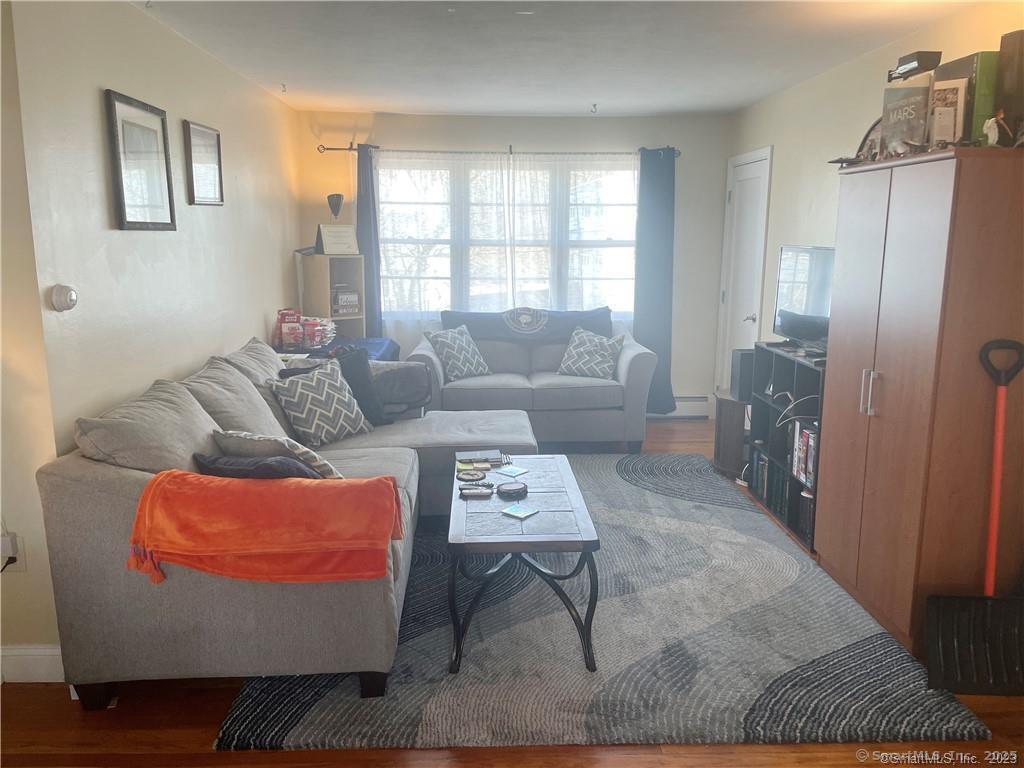 55 Oak Ridge Drive, Unit 60 New Haven, CT 06513 - Photo 5 of 16 a living room with furniture and a window