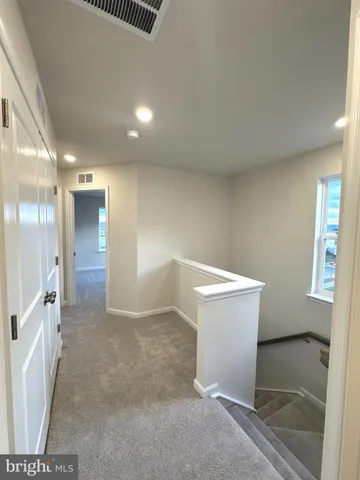 a view of a big room with windows and cabinet