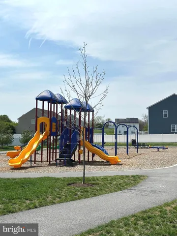 a front view of house with yard and outdoor seating