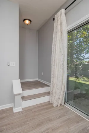 a view of wooden floor and brick walls