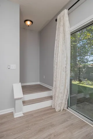 a view of wooden floor and brick walls
