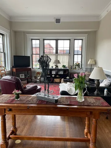 a kitchen with a stove a sink and a window