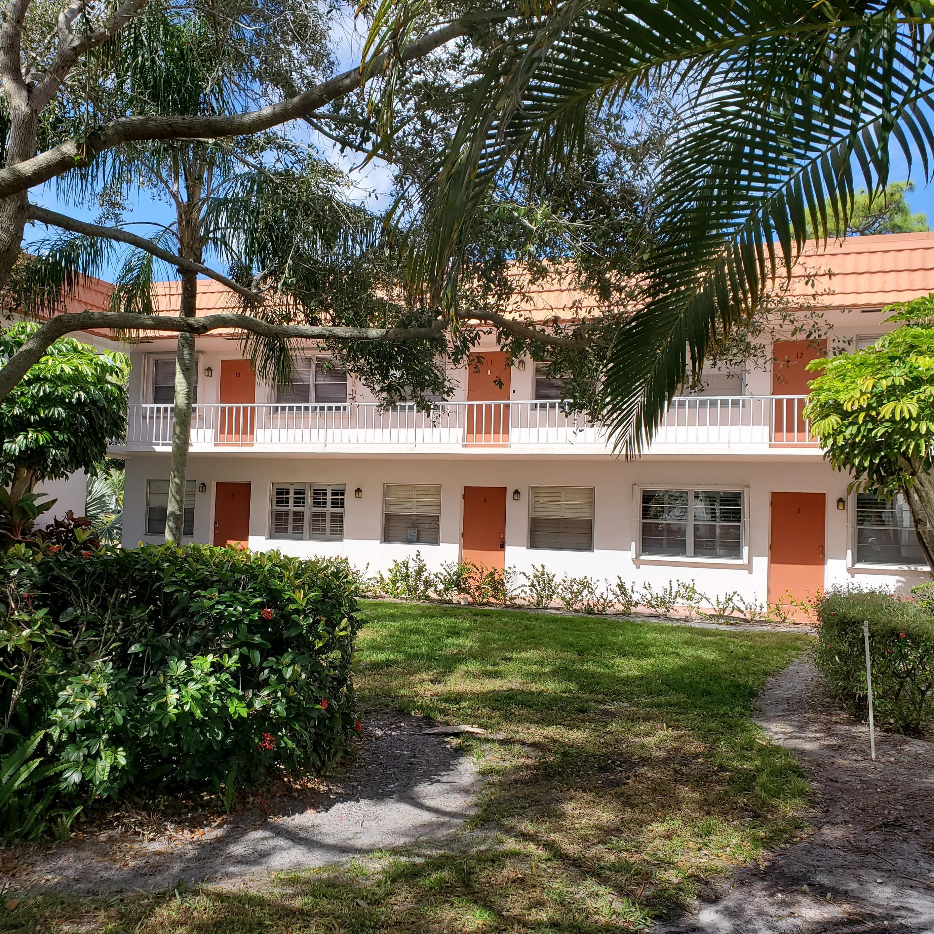 2600 Southeast Ocean Boulevard, Unit A11 Stuart, FL 34996 - Photo 4 of 62 a front view of a house with garden