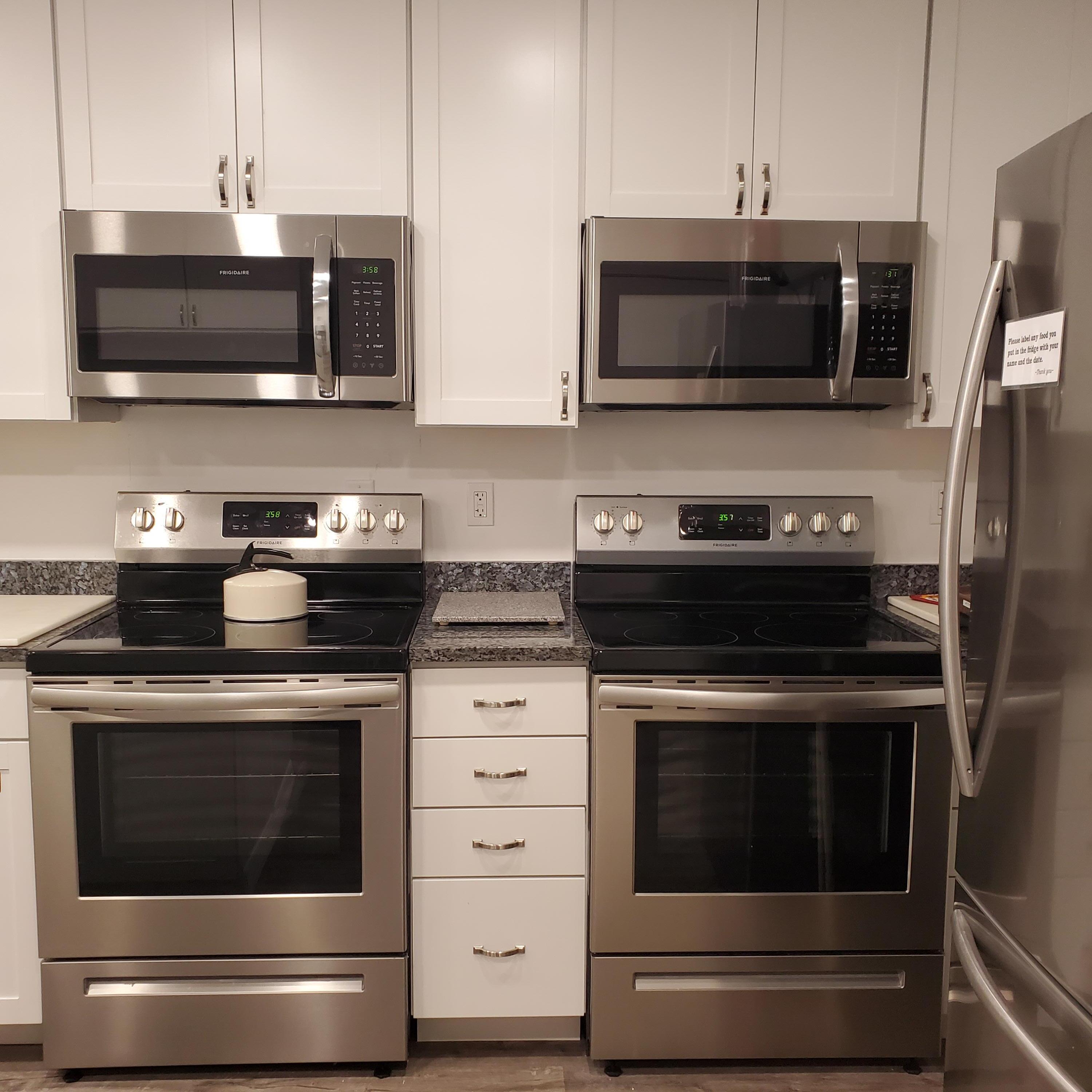 2600 Southeast Ocean Boulevard, Unit A11 Stuart, FL 34996 - Photo 41 of 62 a kitchen with stainless steel appliances granite countertop a stove microwave and oven with granite countertops
