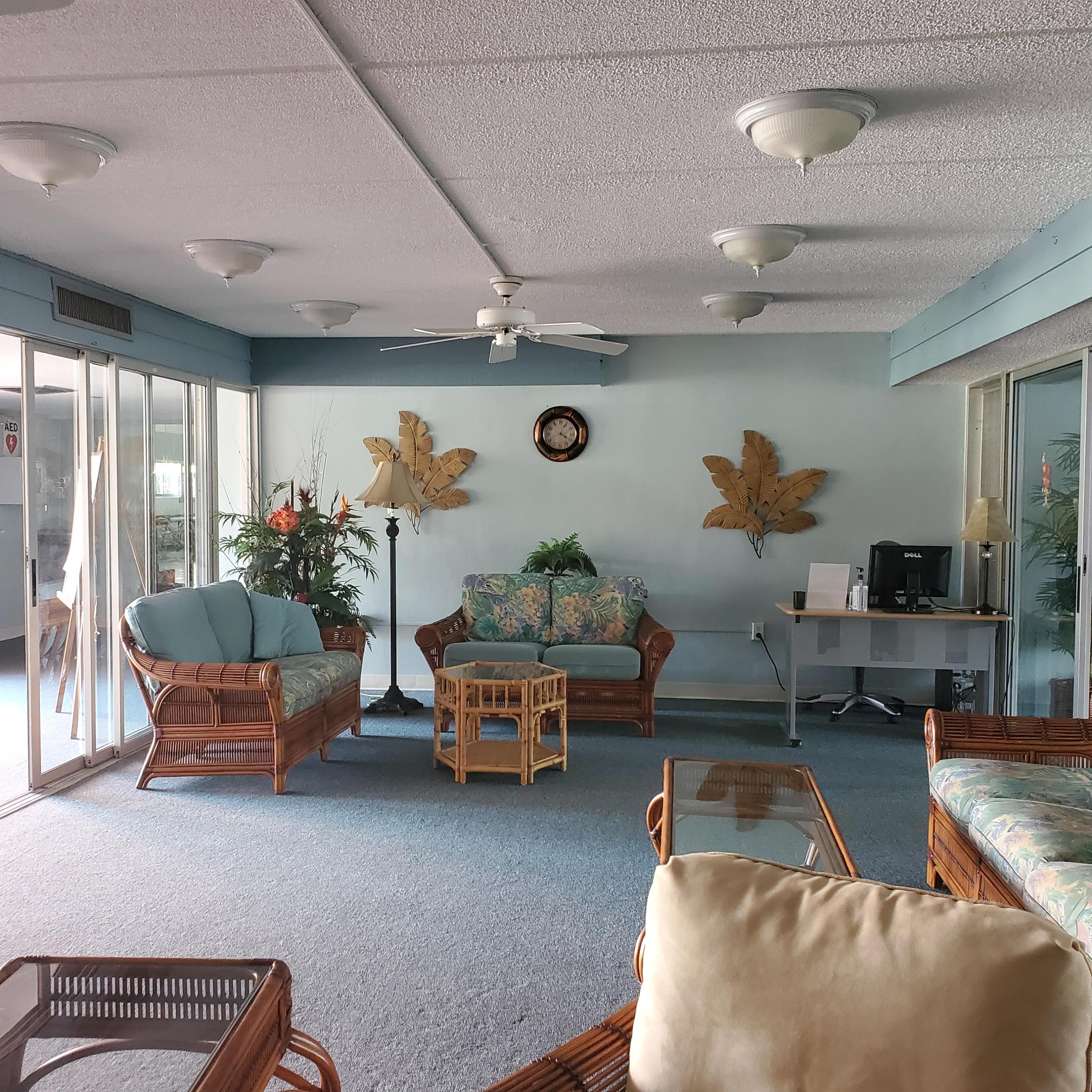 2600 Southeast Ocean Boulevard, Unit A11 Stuart, FL 34996 - Photo 45 of 62 a living room with furniture and a chandelier